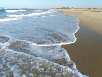 Scenic view of sea shore against sky