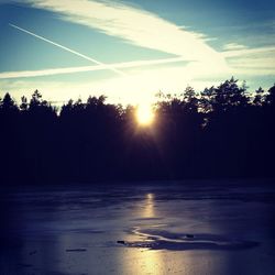 Scenic view of sunset over river