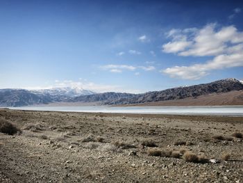 Scenic view of sea against cloudy sky