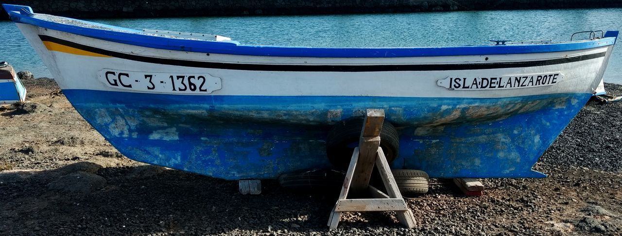 CLOSE-UP OF BOATS MOORED ON SHORE