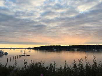 Scenic view of lake against cloudy sky