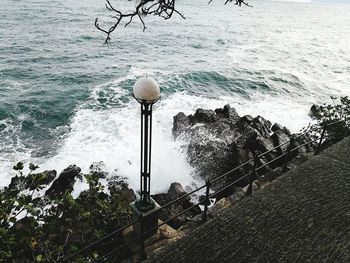 High angle view of bird by sea against sky