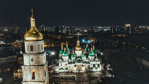 Illuminated buildings in city at night