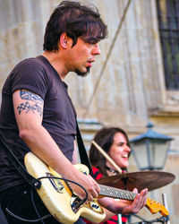 Young man playing guitar