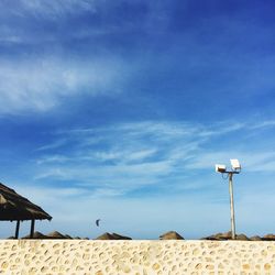 Low angle view of retaining wall against blue sky