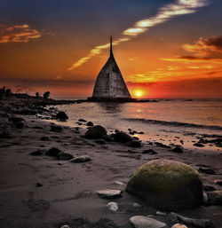 Scenic view of sea against sky at sunset