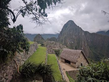 Scenic view of mountains against cloudy sky