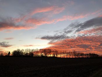 Scenic view of dramatic sky during sunset