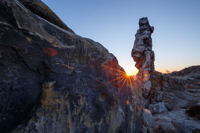 Rock formation on mountain against sky