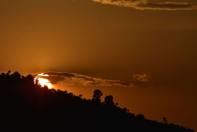 Scenic view of silhouette mountain against sky during sunset