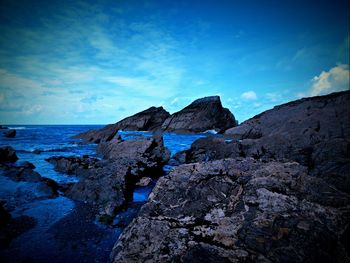 Scenic view of sea against blue sky