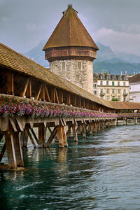 View of bridge over river against buildings