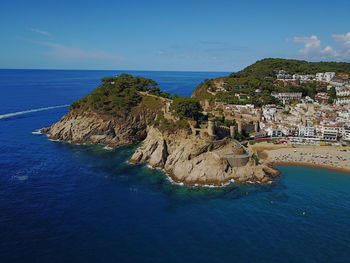 Panoramic view of sea against blue sky