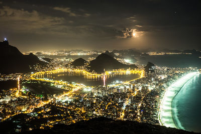 Aerial view of illuminated city at night