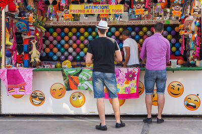 Rear view of people at market