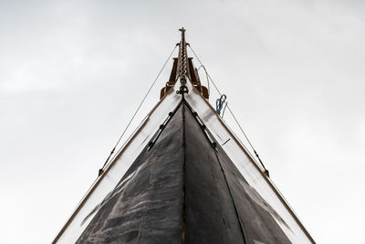 Low angle view of sailboat on building against sky