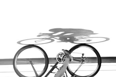 Close-up of toy bicycle against white background