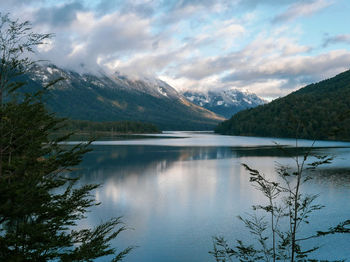 Scenic view of lake and mountains against sky