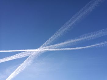 Low angle view of vapor trails in sky