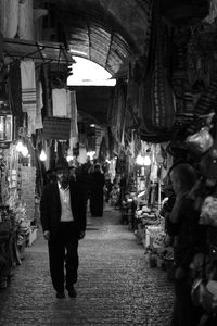 People walking on street at night