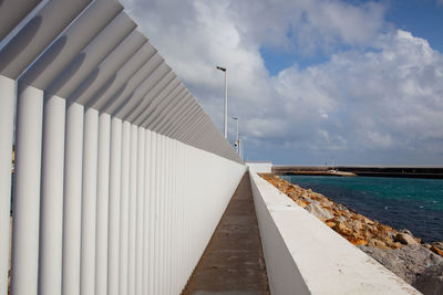 Pier over sea against sky