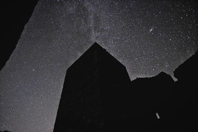 Low angle view of built structure against sky at night