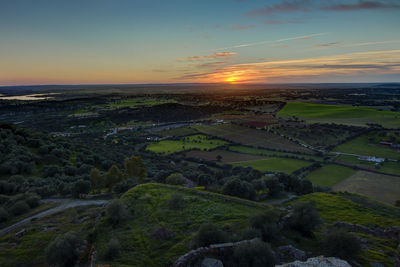 Scenic view of landscape against sky during sunset