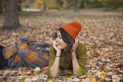 Happy young couple hanging out in a park together