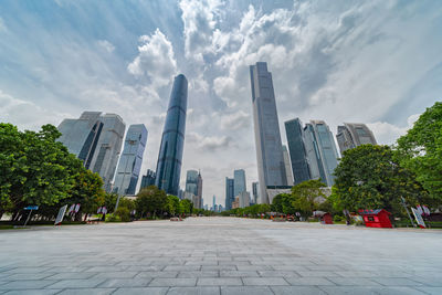 City buildings against cloudy sky