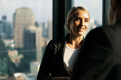 Businesswoman having discussion with colleague at office