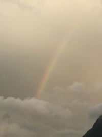 Low angle view of rainbow against sky