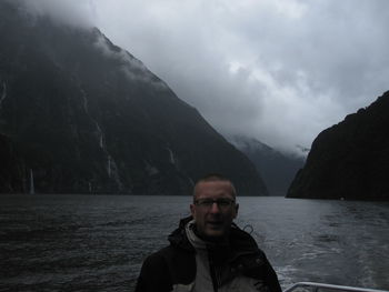Portrait of man in mountains against sky