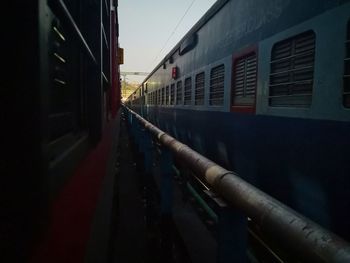 Train at railroad station against sky