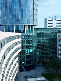 Modern buildings in city against sky