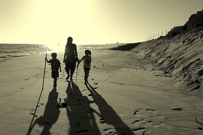 Silhouette of people on beach