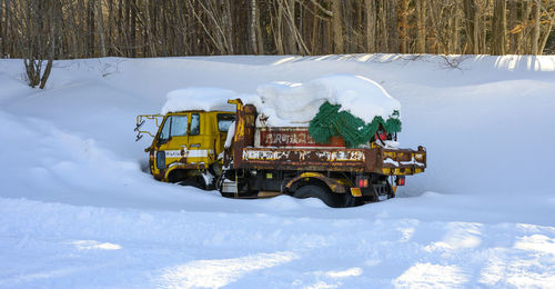 Truck covered by snow in japan.