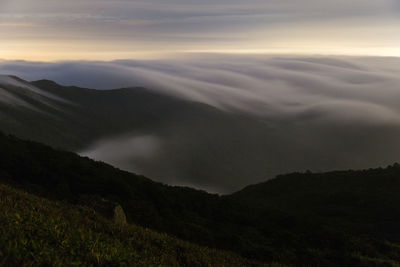 Scenic view of mountains against sky during sunset