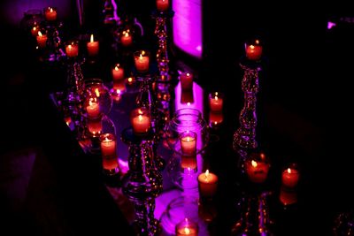 Low angle view of illuminated lanterns hanging at night