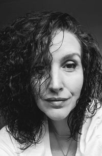 Close-up portrait of smiling young woman