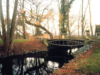 Bridge over river with buildings in background