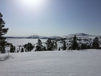 Scenic view of snowcapped mountains against clear sky