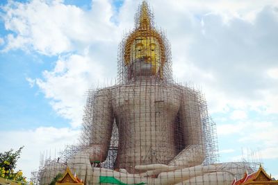 Low angle view of statue against cloudy sky