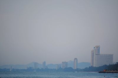 Modern buildings in city against sky