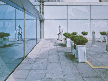 Empty footpath by building in city