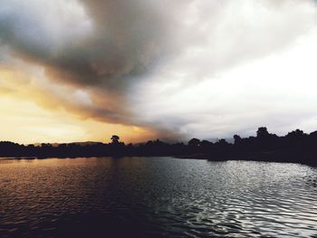 Scenic view of sea against cloudy sky