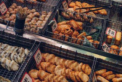 High angle view of various food in metal containers for sale
