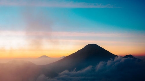 Scenic view of mountains against sky during sunset