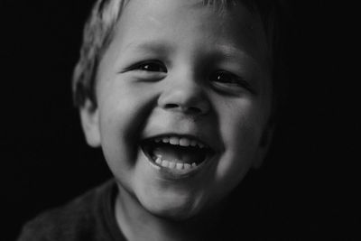 Little boy laughing black and white