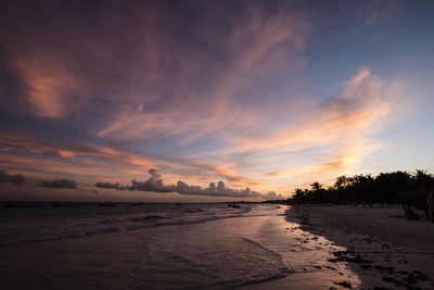 View of beach against cloudy sky