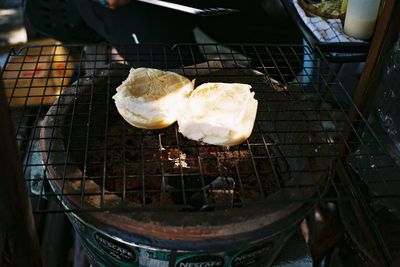 High angle view of meat on barbecue grill